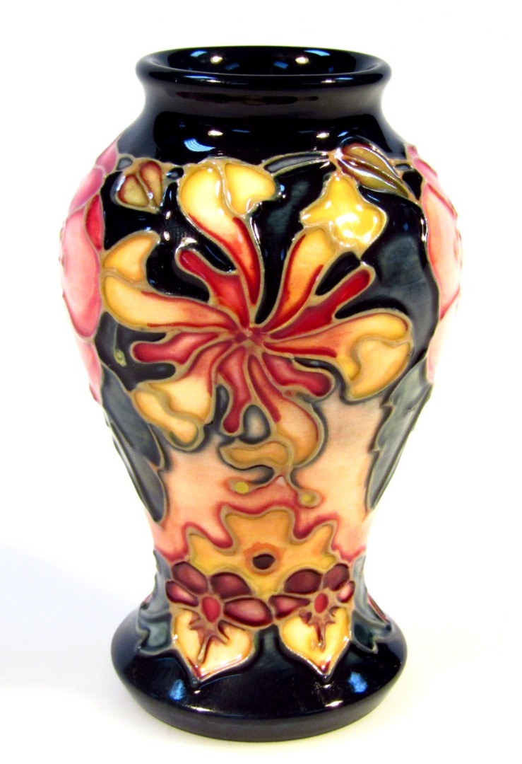 Appraisal: A Moorcroft pottery Honeysuckle pattern vase of inverted circular form