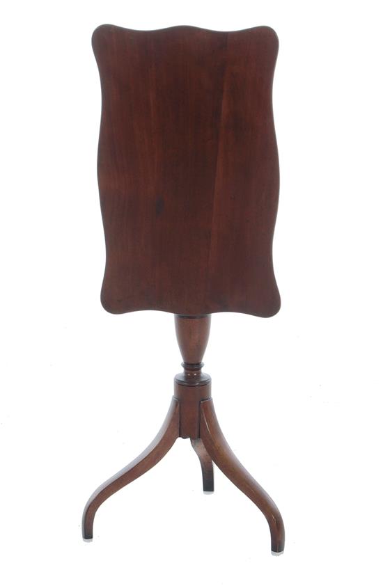 Appraisal: American cherry tilt-top candlestand mid th century serpentine top turned