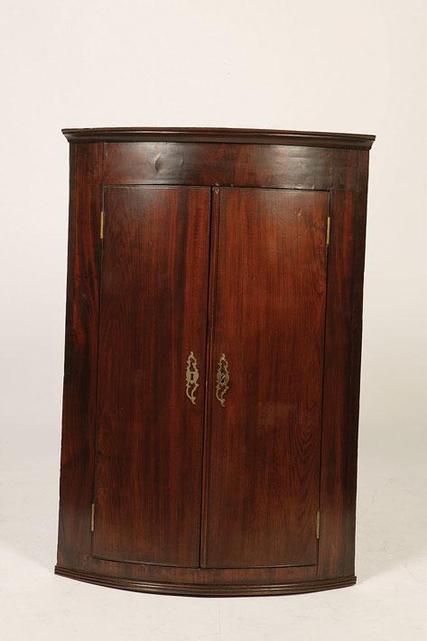 Appraisal: A GEORGE III MAHOGANY BOW FRONT HANGING CORNER CUPBOARD with