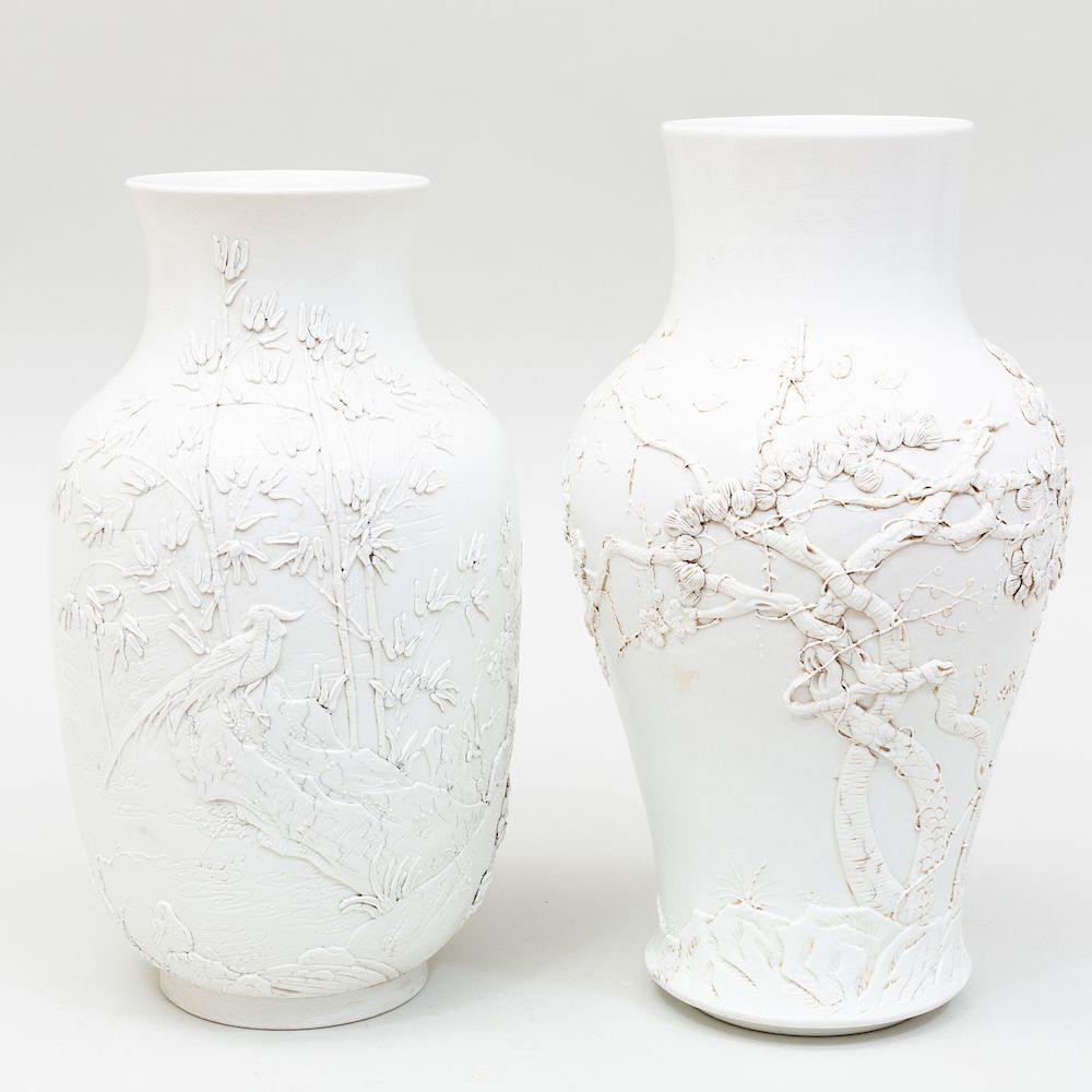 Appraisal: Two Chinese White Glazed Relief Decorated Porcelain Vases Both stamped