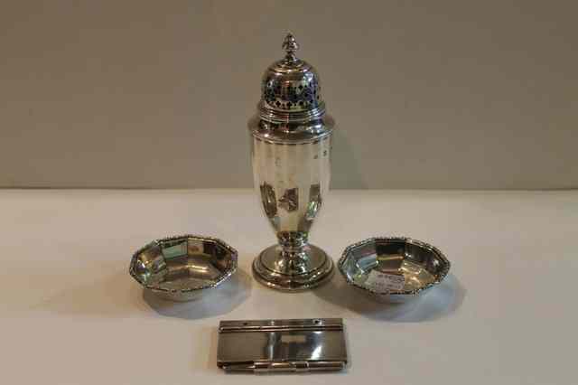 Appraisal: A GEORGIAN STYLE SILVER CASTER of baluster form on pedestal