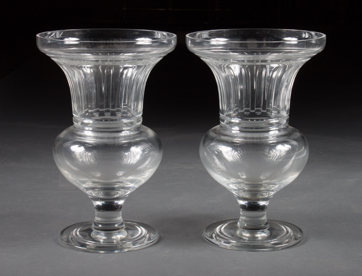 Appraisal: Pair of Classical style colorless glass urns in H Condition