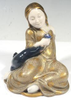 Appraisal: Royal Copenhagen Porcelain Seated Girl The child in a hand-painted