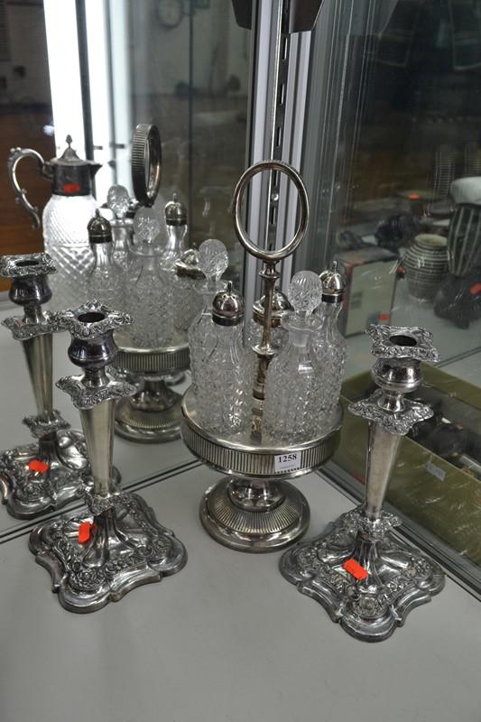 Appraisal: MERIDEN FIVE BOTTLE CRUET SET AND A PAIR OF CANDLESTICKS