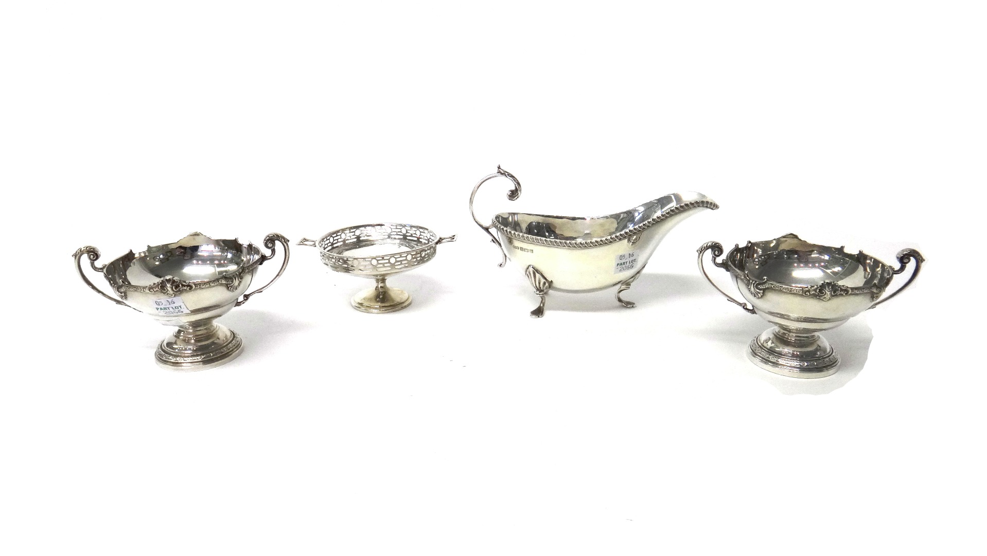 Appraisal: Silver comprising two similar twin handled bonbon dishes decorated with