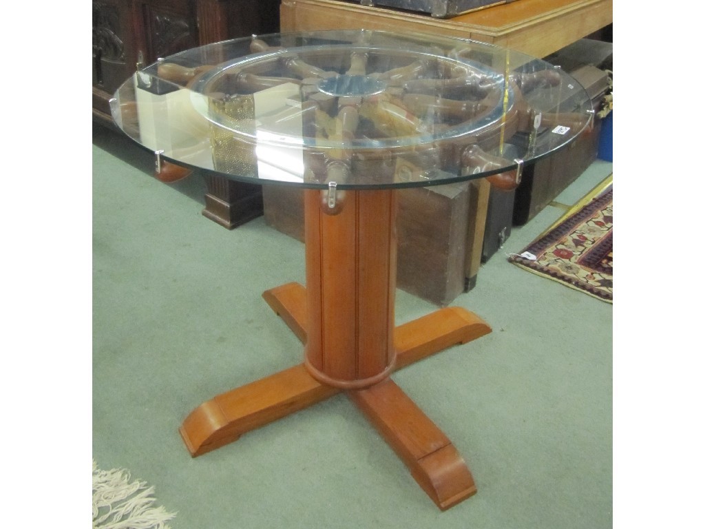 Appraisal: Revolving novelty ships wheel coffee table with glass top