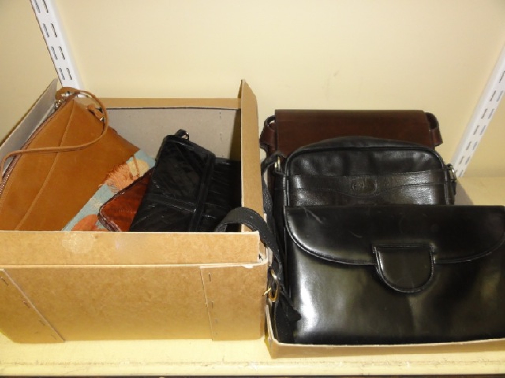 Appraisal: Two brown leather Ferragamo shoulder bags a black leather clutch