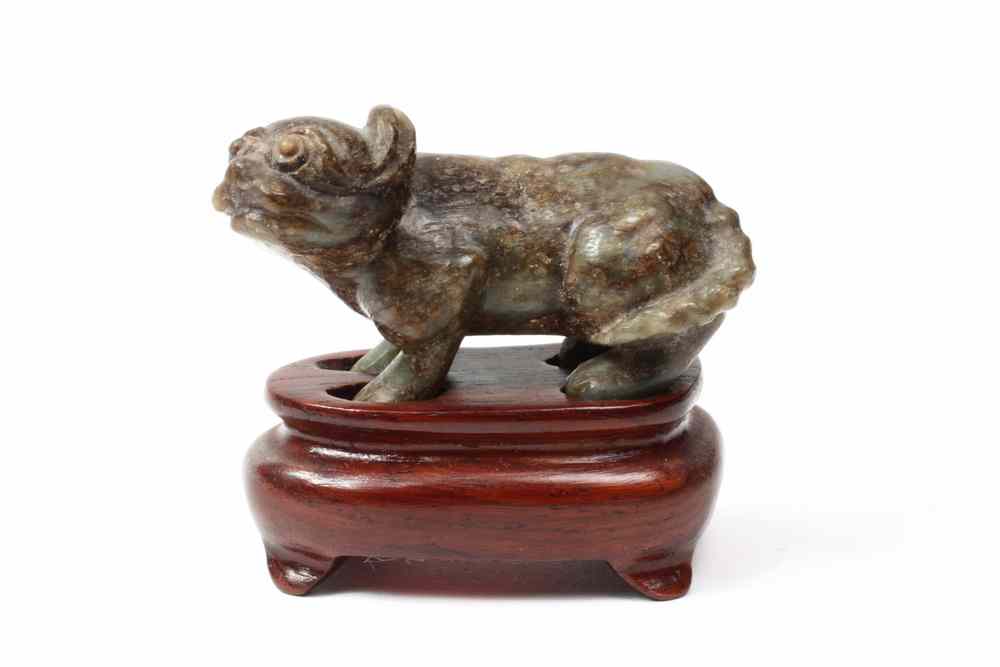 Appraisal: CARVED JADE DOG - th c fashioned in the full