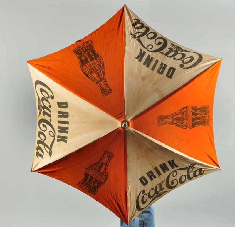 Appraisal: s Metal and Canvas Coca-Cola Umbrella Description Features the bottle