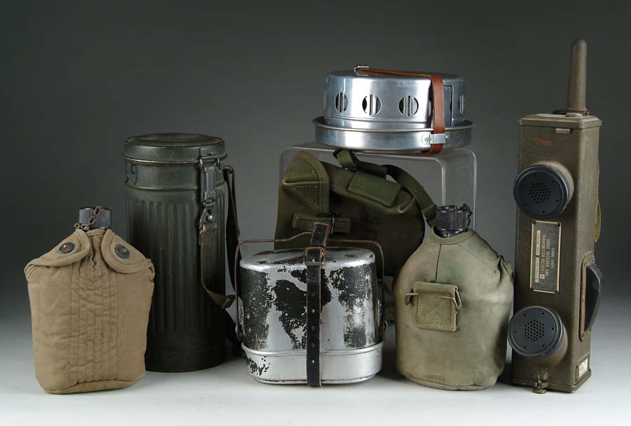 Appraisal: CANTEENS LANDMINES ETC German Bakelite canteen with canvas straps good