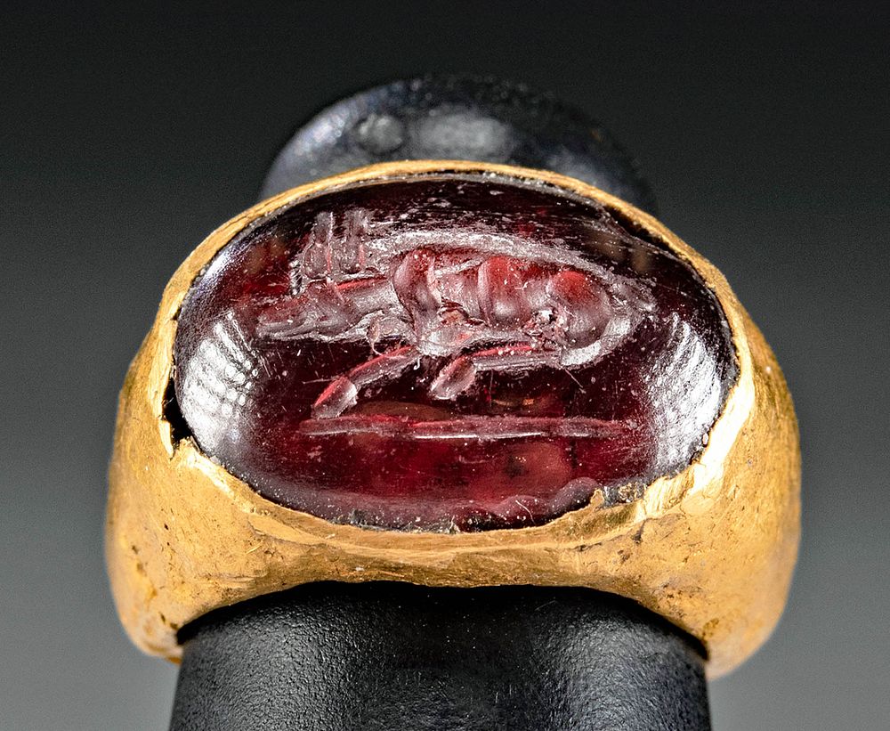 Appraisal: Roman Gold Ring Garnet Intaglio w Recumbent Bull Roman Imperial