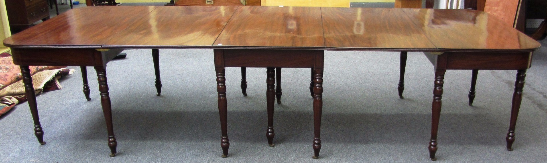 Appraisal: A Regency mahogany triple section extending dining table to comprise