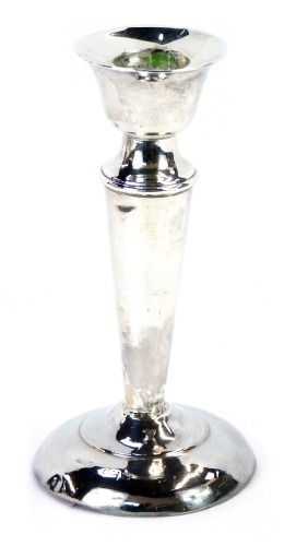 Appraisal: A George V silver taper candlestick on a reeded column