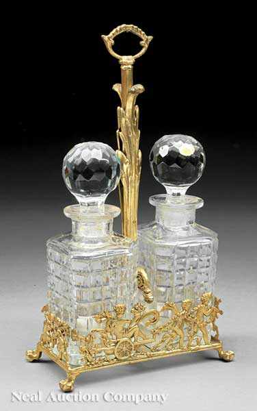 Appraisal: A Pair of Cut Crystal Decanters in a Reticulated Gilt