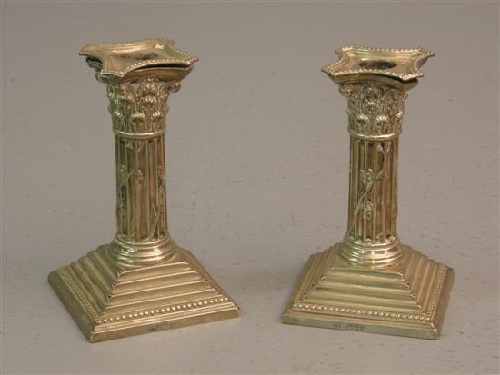 Appraisal: Pair of Victorian silver Corinthian column candlesticks with detachable nozzles