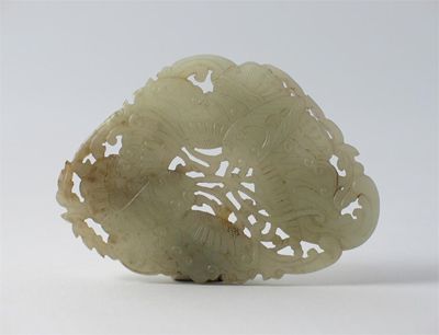 Appraisal: A Chinese jade belt buckle carved with two moths th