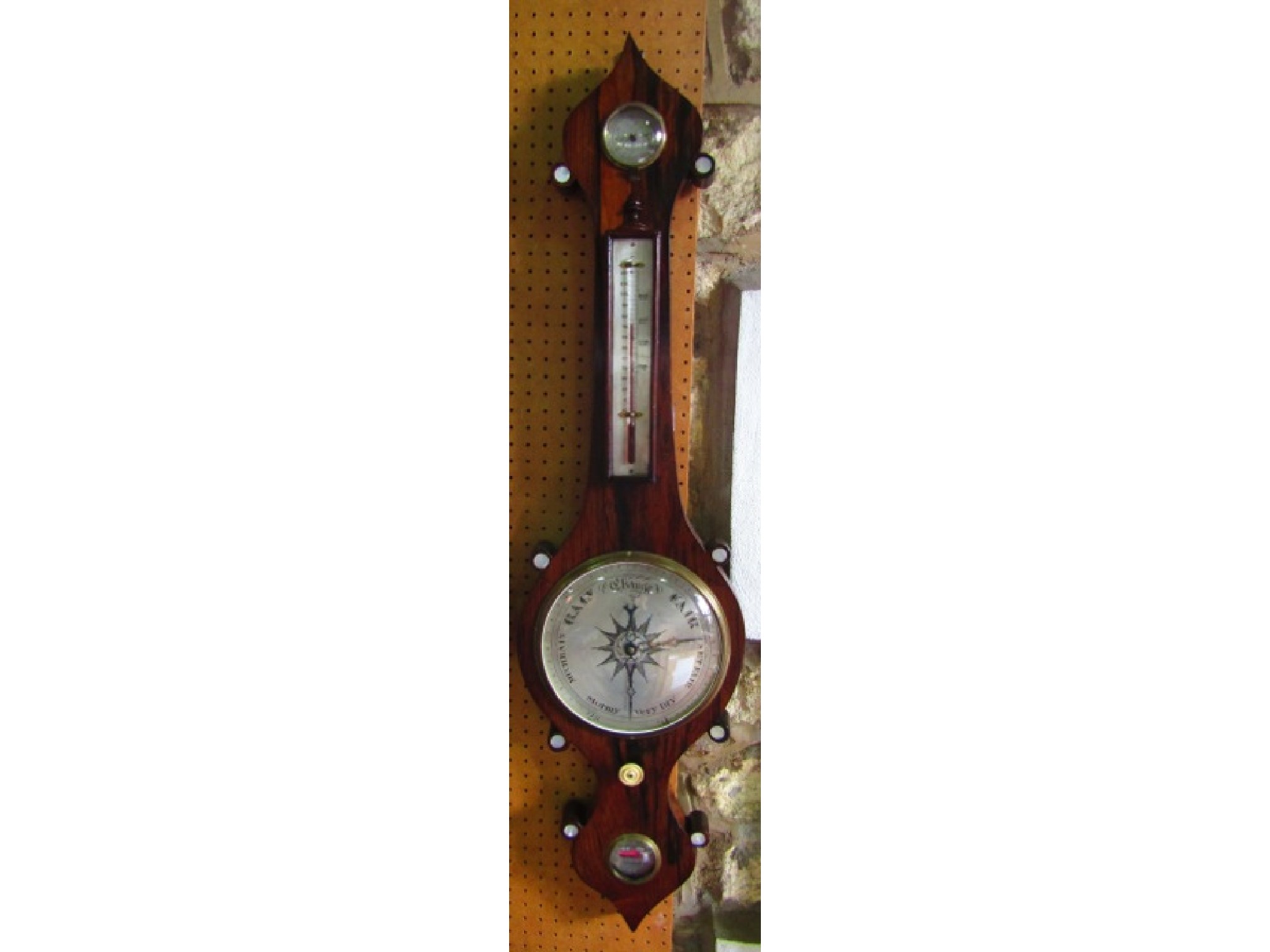 Appraisal: A mid- th century rosewood wheel barometer with silvered dials