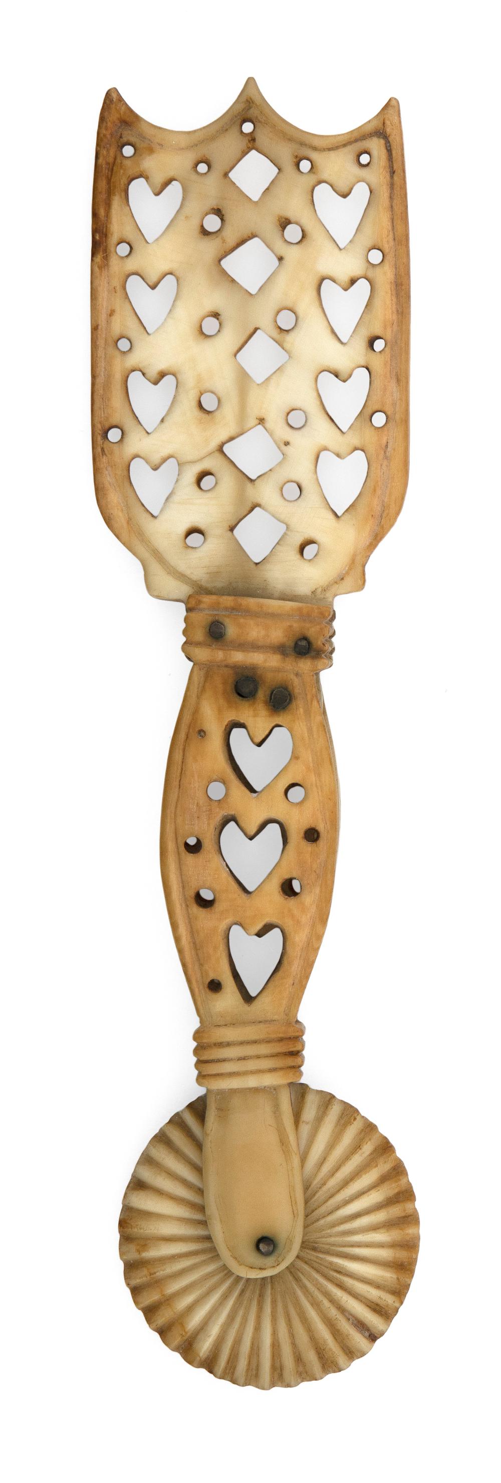 Appraisal: SAILOR-MADE WHALE IVORY NANTUCKET PIE CRIMPER WITH PIERCED HEART AND