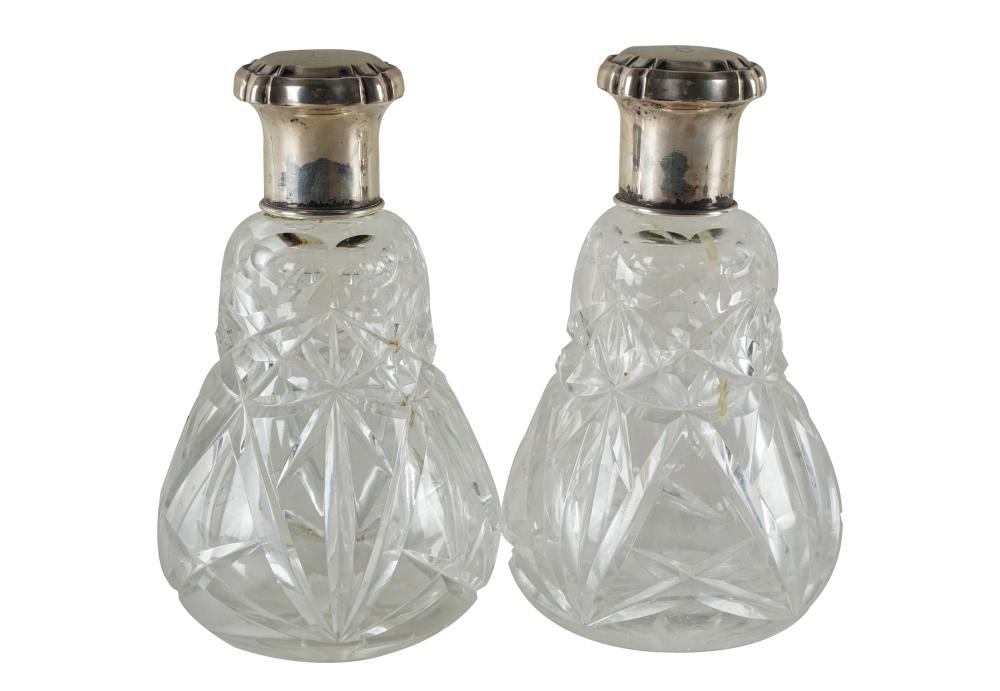 Appraisal: PAIR OF GERMAN SILVER CUT-GLASS PERFUME BOTTLESthe covers with maker's