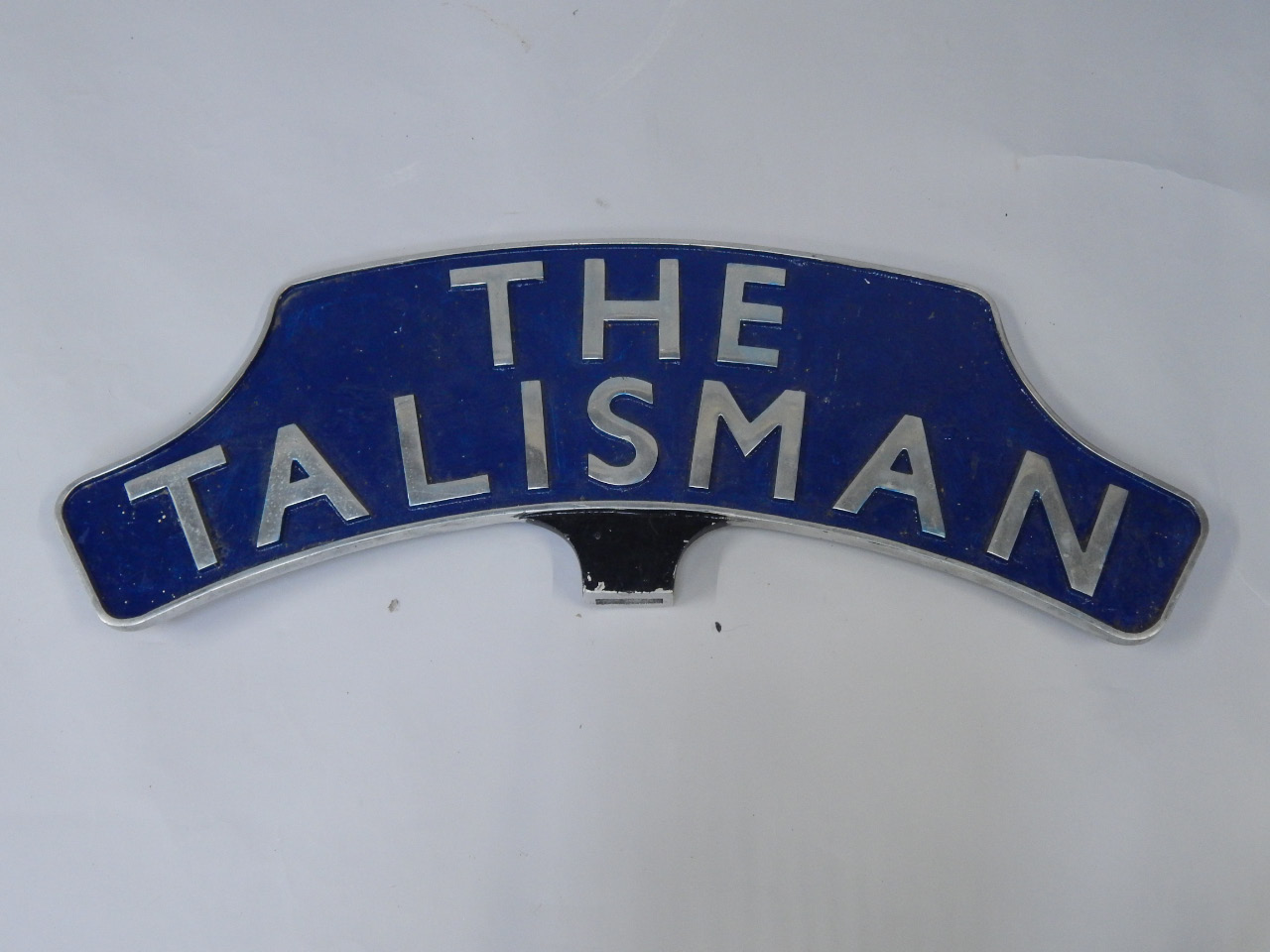 Appraisal: A cast metal and enamel replica train headboard The Talisman