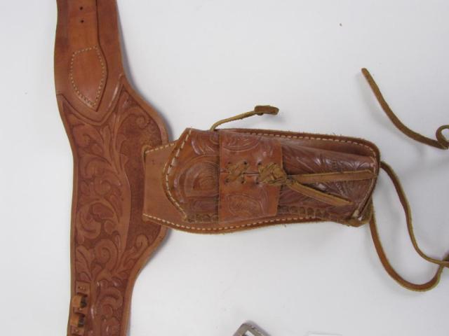 Appraisal: Tooled leather cowboy-style right-hand holster gun belt light tan