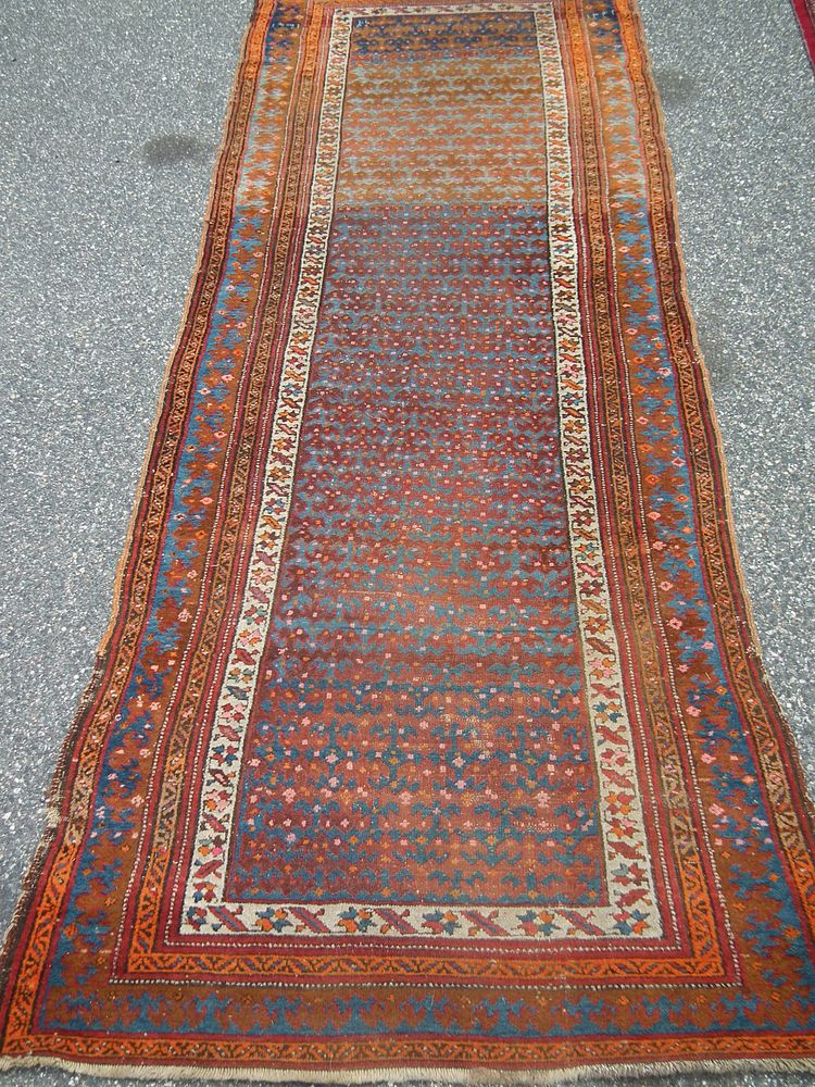 Appraisal: ANTIQUE CAUCASIAN RUNNER Antique Caucasian runner carpet in orange and