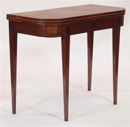 Appraisal: A George III foldover card table the rounded rectangular crossbanded