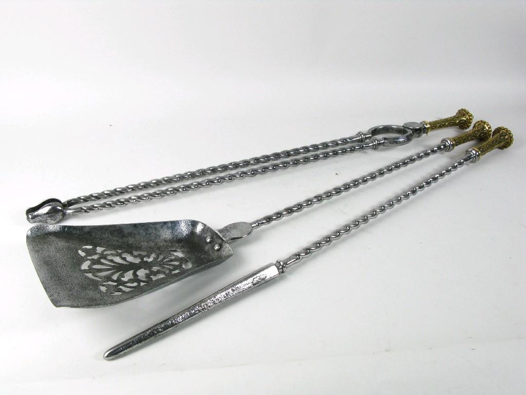 Appraisal: A set of th Century steel and brass handled Fire