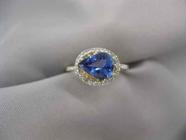 Appraisal: Tanzanite Diamond Ring pear shape gem weighing carat surrounded by