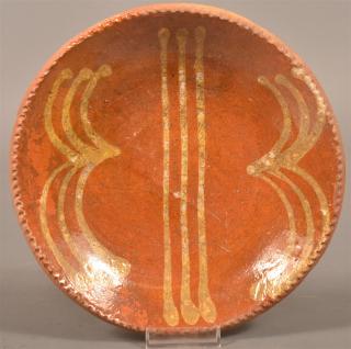 Appraisal: Pennsylvania th Century Redware Plate Pennsylvania th Century Glazed Redware