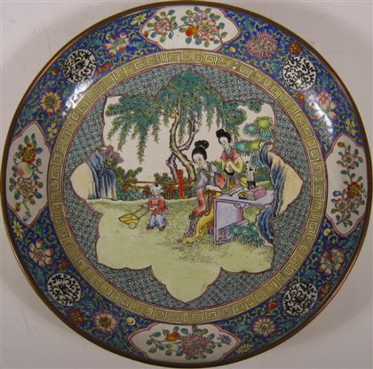 Appraisal: Chinese enamel bowlThe shallow metal bowl enameled with two meiren