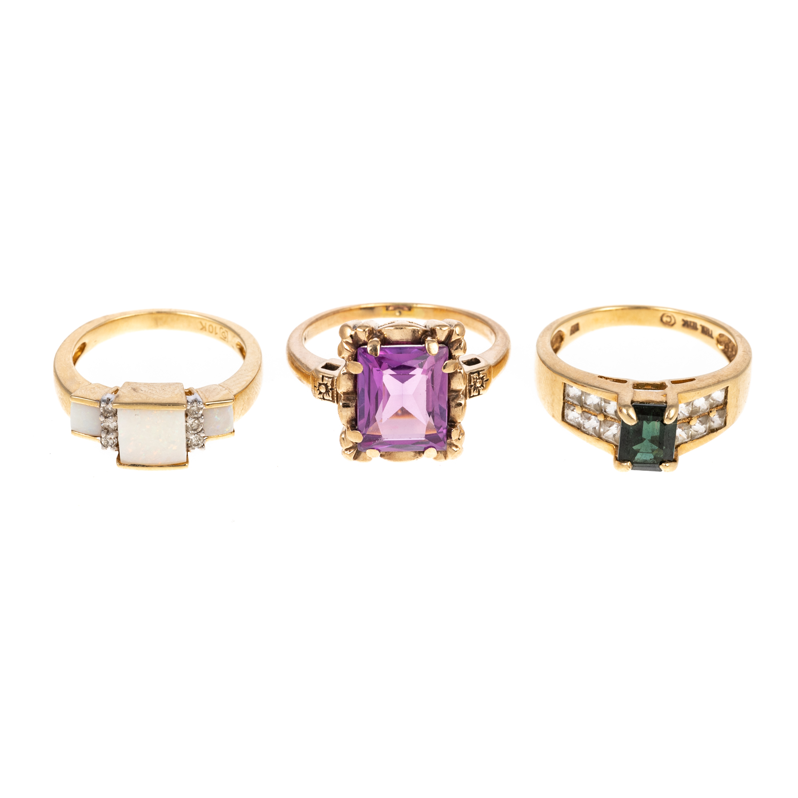 Appraisal: THREE LARGE GEMSTONE RINGS IN K K yellow gold ring