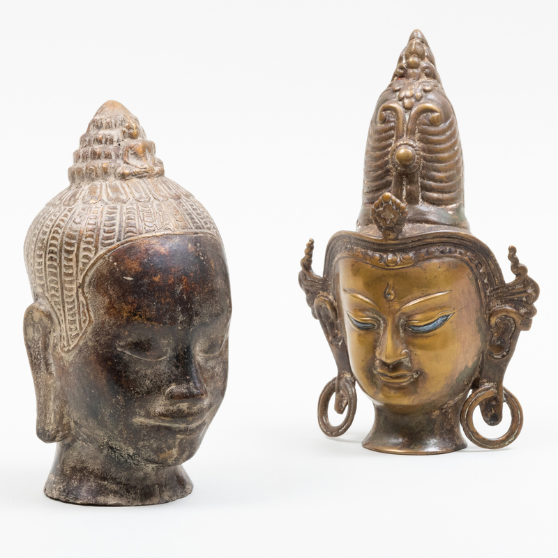 Appraisal: Two East Asian Bronze Heads of Dieties Unmarked The larger