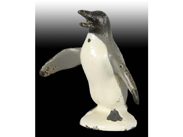 Appraisal: Seated Elephant Penguin Cast Iron Paperweight Description Both made by