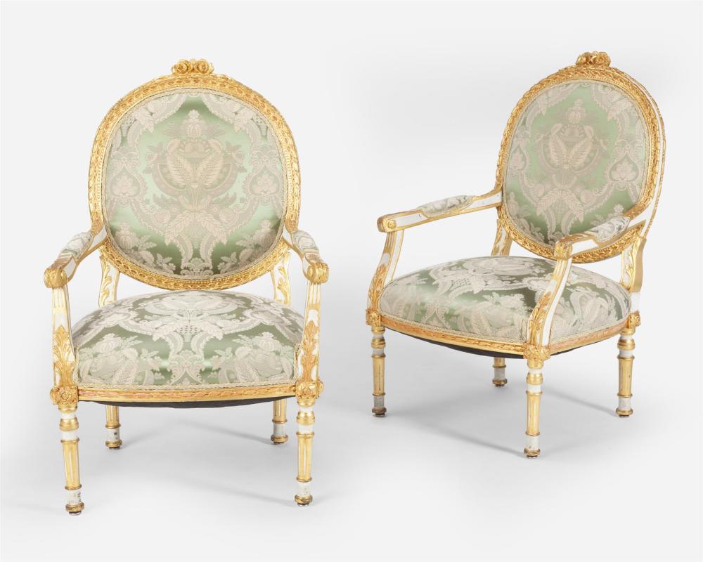 Appraisal: A pair of Louis XVI-style carved giltwood fauteuils First-half th