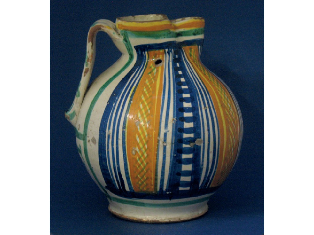 Appraisal: AN ITALIAN MAJOLICA JUG decorated overall in polychrome with line