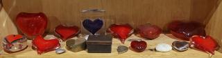 Appraisal: One shelf of heart shapped paper weights executed in glass