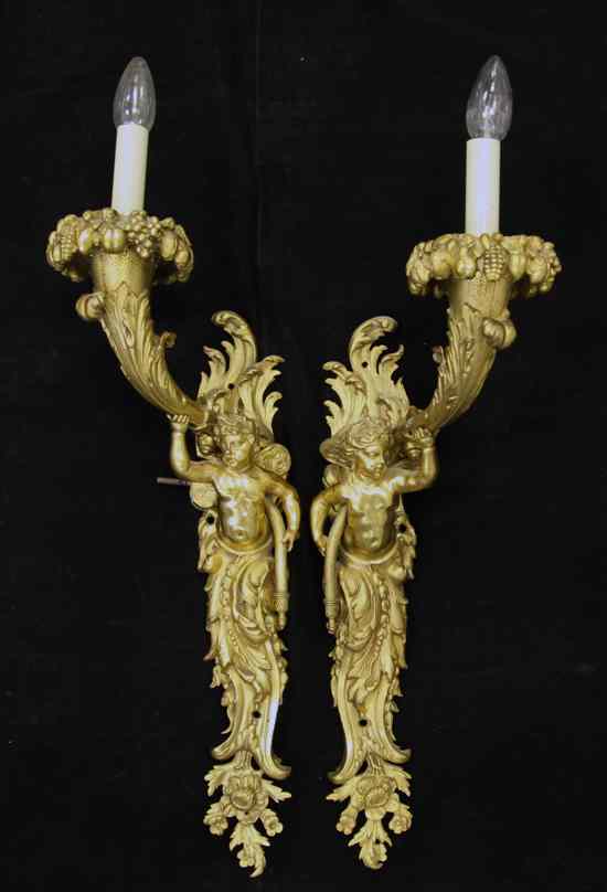 Appraisal: A pair of Louis XV style ormolu wall lights modelled