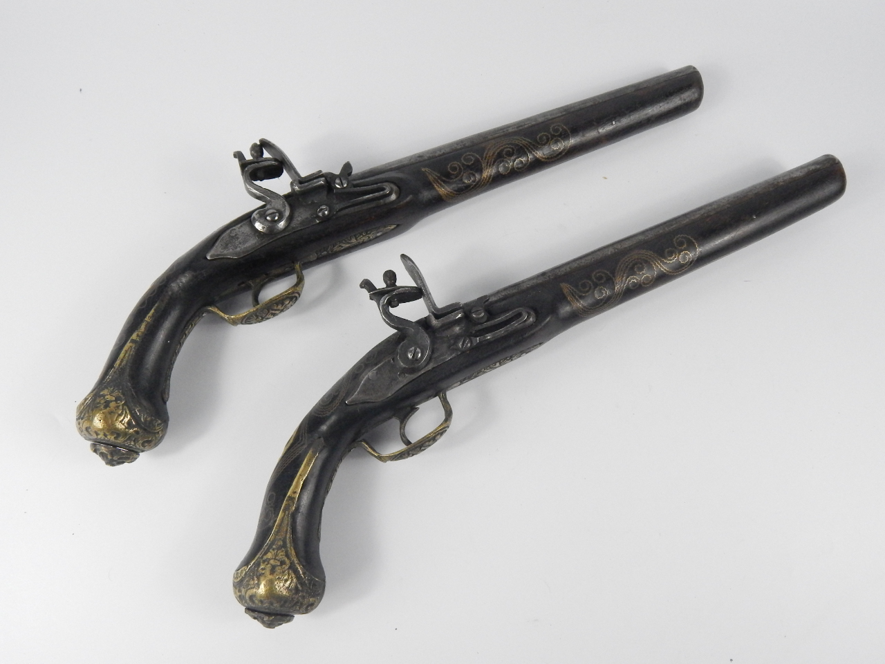 Appraisal: A pair of replica flintlock pistols with brass wire inlaid