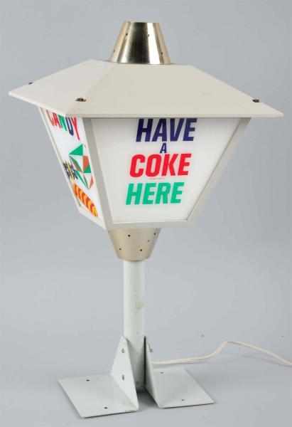 Appraisal: s Revolving -Sided Coca-Cola Light-Up Sign Description Rotates and lights