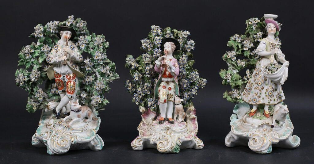 Appraisal: Chelsea or Derby style porcelain figures with bocage backgrounds Tallest