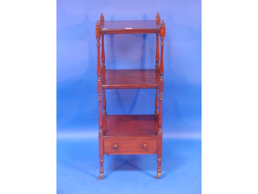 Appraisal: A Georgian mahogany three-tier whatnot with slender turned supports and