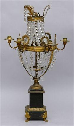 Appraisal: EMPIRE-STYLE CUT-GLASS MOUNTED GILT-BRONZE SIX-LIGHT CANDELABRUM ON TOLE PEINTE PEDESTAL