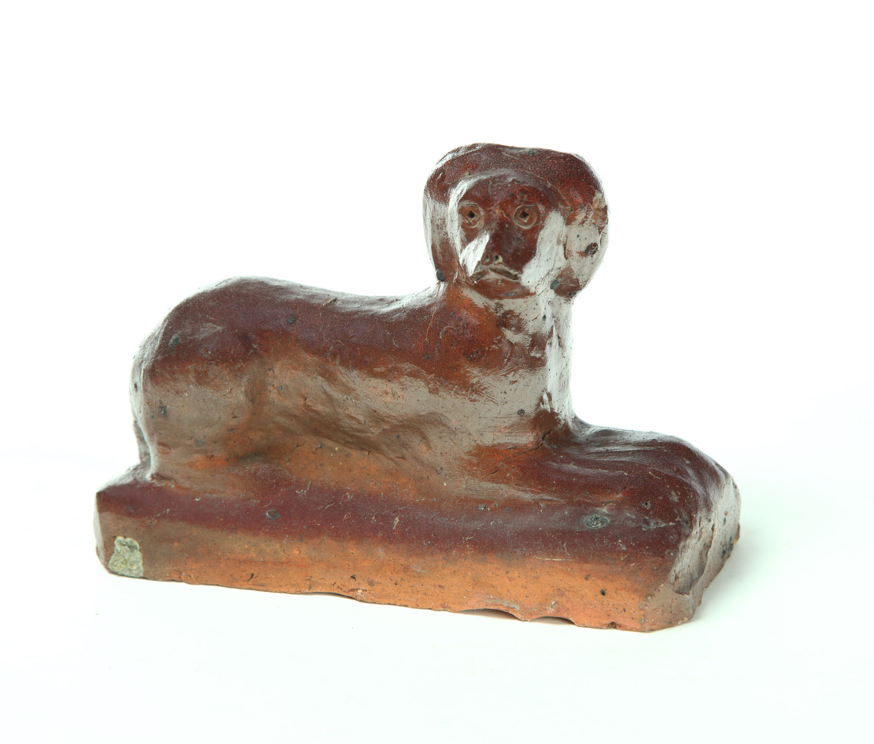 Appraisal: SEWERTILE DOG Ohio early th century Reclining dog on base