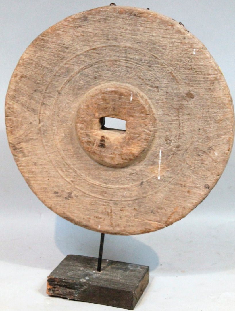 Appraisal: A thC hardwood Tibetan wheel the circular body with a