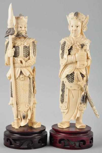 Appraisal: Pair of Solid Ivory Figures Description Circa both have war