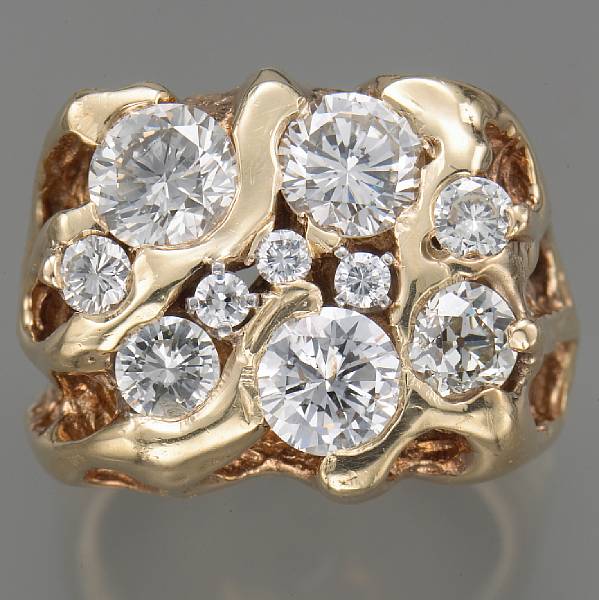 Appraisal: A diamond and fourteen karat gold gent's ring principal diamonds