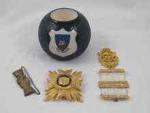 Appraisal: A Carlton ware match striker with Oxford University emblem to