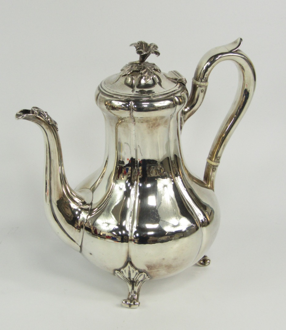 Appraisal: A Victorian silver melon shaped coffee pot of vertical fluted