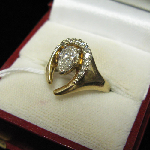 Appraisal: DIAMOND AND FOURTEEN KARAT GOLD RING WITH APPRAISAL The U-form